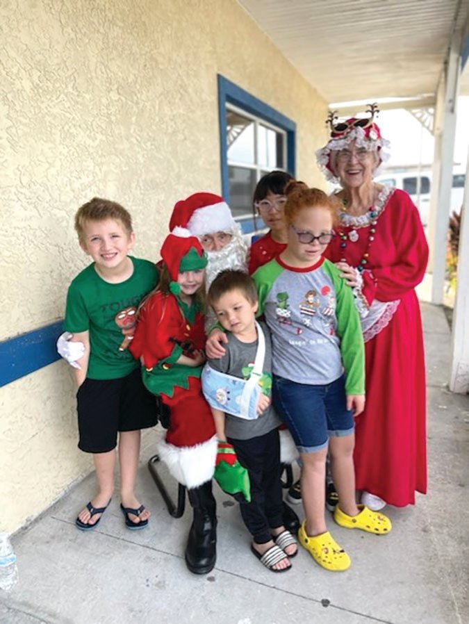 Santa and Mrs. Clause visits with kids during the "Kids Shopping Day."